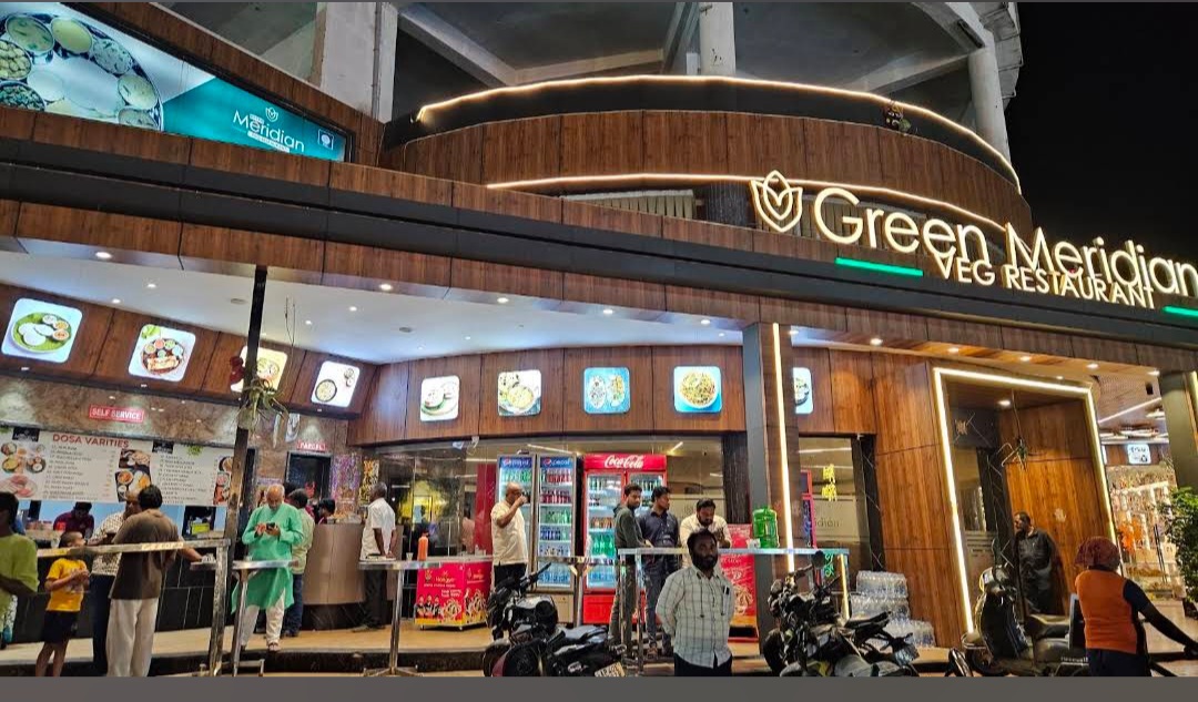 Green Meridian Veg Restaurant signboard